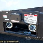 Exterior fuel dispensing system compartment on RV with dual gauges and safety warning labels