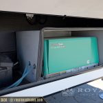 Cummins Onan RV generator EVAP system installed in exterior storage compartment with turquoise colored generator unit