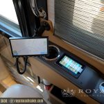 Motorhome dashboard showing GPS navigation map display and touchscreen control panel