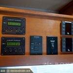 RV control panel with dual 30 amp MPPT technology displays and various electrical system switches